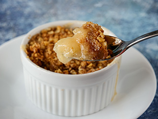 Digging into an apple crisp